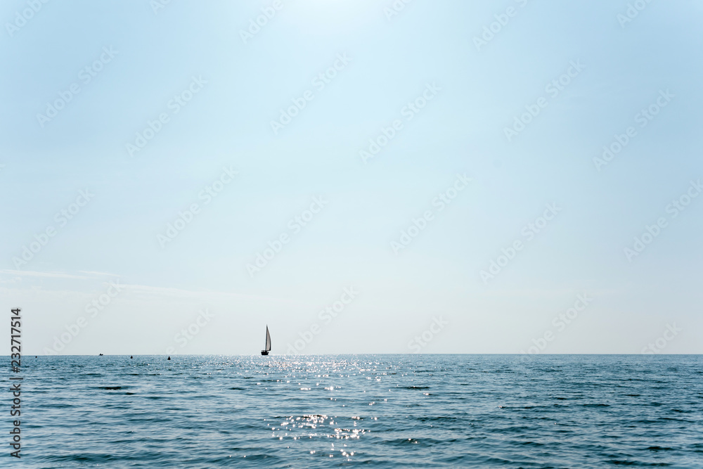 sailboat that is sailing in the middle of the sea