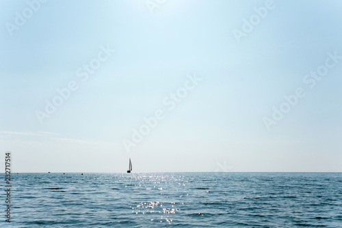 sailboat that is sailing in the middle of the sea © Stillkost