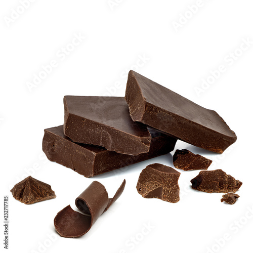 Broken or cracked dark chocolate bars, chips or pieces and curl isolated on white background photo