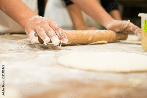 Young children make dough products. Hands closeup © Rakursstudio