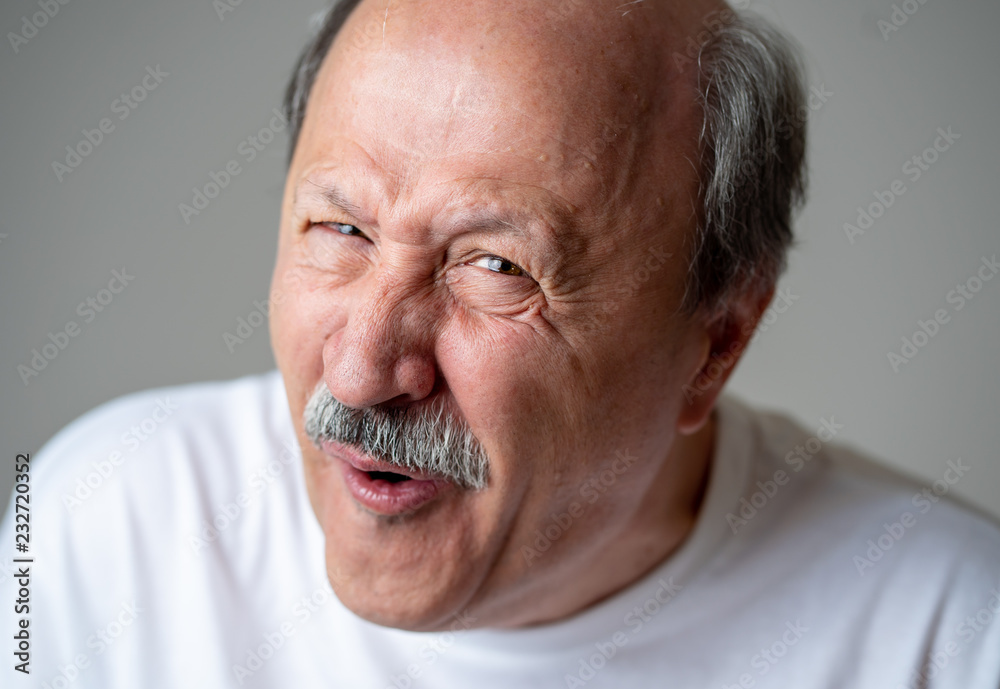 Portrait of comic and crazy senior man with funny face Stock Photo | Adobe  Stock