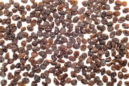 Red dried grapes  raisins isolated on white background with clipping path.