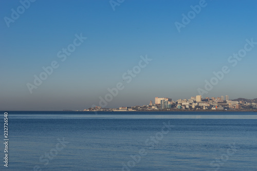 Seascape with views of the coastline and the architecture of the city.