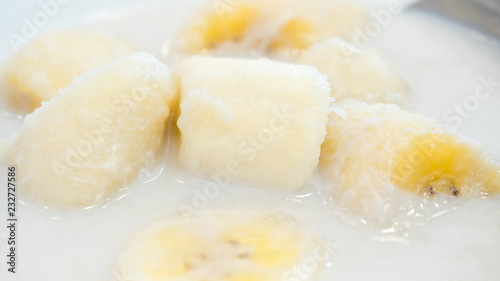 Banana in coconut milk close up