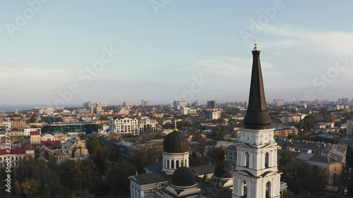 Aerial drone rotation around the spire of Preobrazhensky Cathedral Odessa during sunset