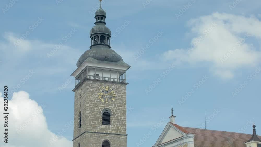 tower with clock of town hall in small old european city, close-up against sky tower with clock of town hall in small old european city, close-up against sky
