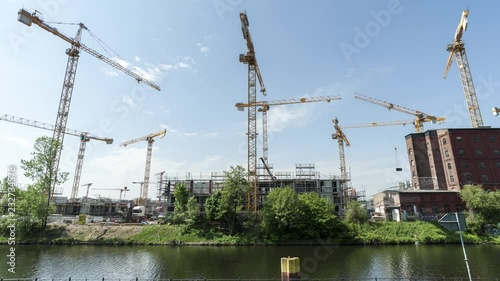 Operating cranes at building site in Berlin, timelapse