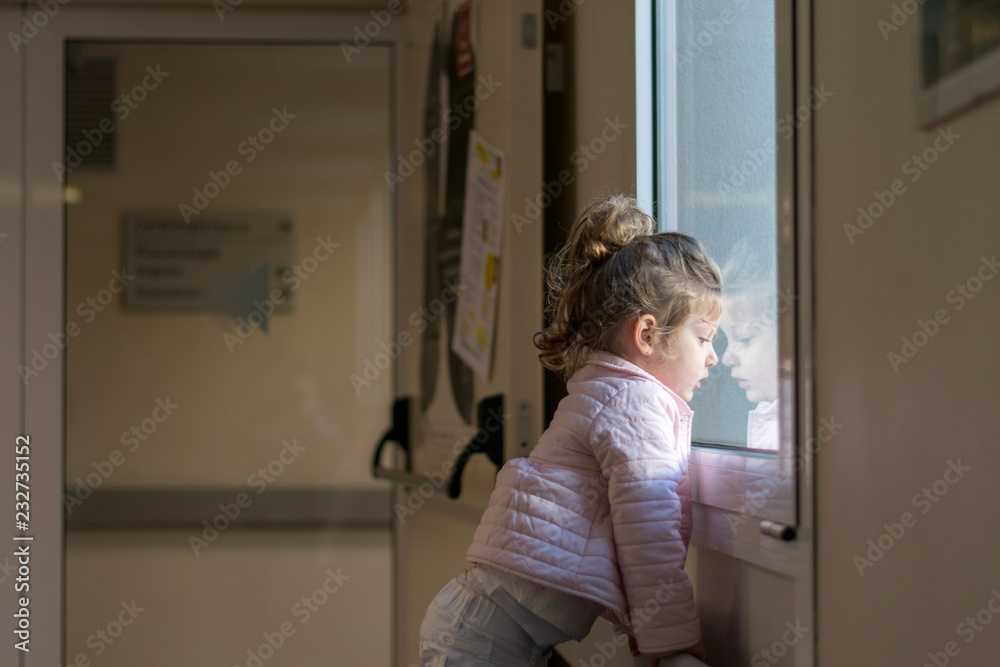 little girl looking out the window little girl looking out the window