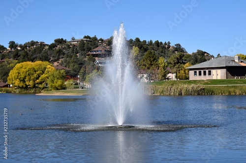 Water fountain in a lake at a city park 