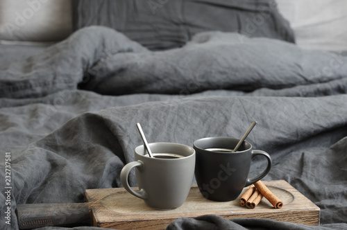 Two coffee mug in dark grey bed