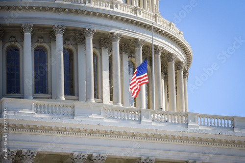 US Capitol Building with a flag on a half staff photo