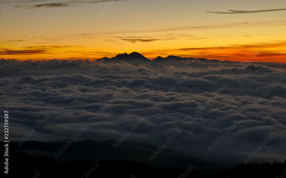 Beautiful sunrise with fog in the mountains