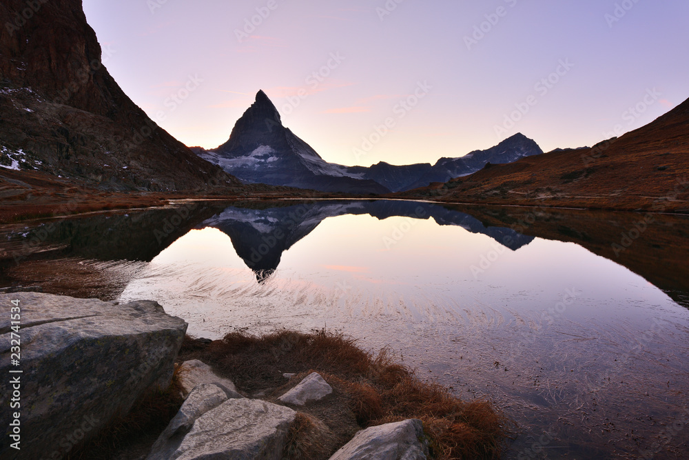 Matterhorn peak reflected in Riffelsee at sunset