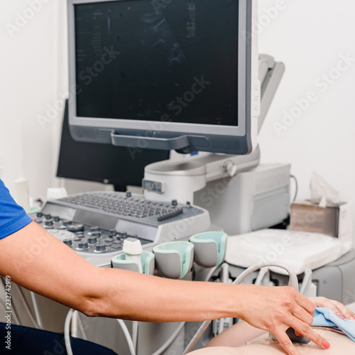 doctor using ultrasound machine to make test for patient