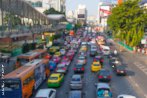 Blurry Traffic jam in Ratchaprasong Road at Bangkok, Thailand.