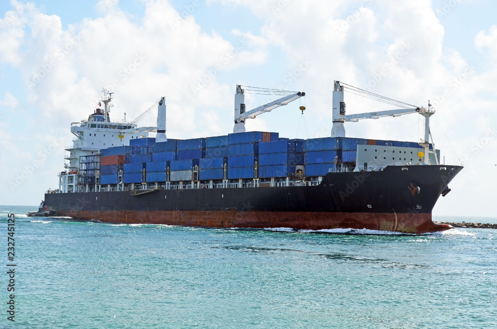 container ship approaching the Port of Miami a Latin America trading hub. container ship approaching the Port of Miami a Latin America trading hub.
