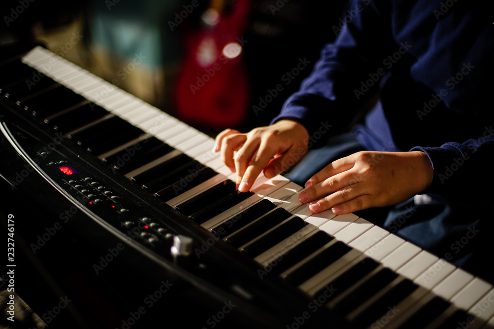 Hands playing on musical instrument | Electric piano