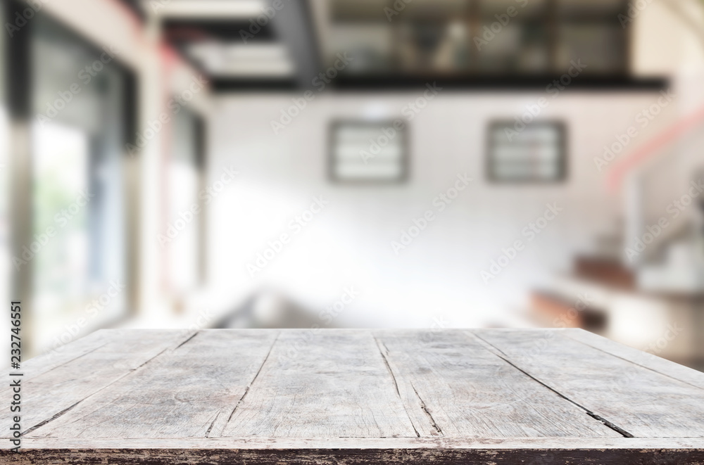 Wooden board empty Table Top And Blur Interior over blur in coffee shop Background, Mock up for display of product Wooden board empty Table Top And Blur Interior over blur in coffee shop Background, Mock up for display of product