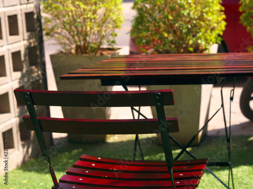Wallpaper Mural Wooden dining table and chair at green yard balcony in morning. Torontodigital.ca