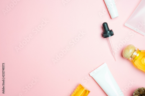 natural cosmetics skincare and leaves on pink