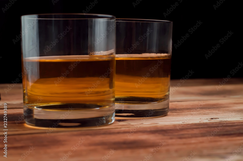 Glasses for whiskey on a wooden table Glasses for whiskey on a wooden table