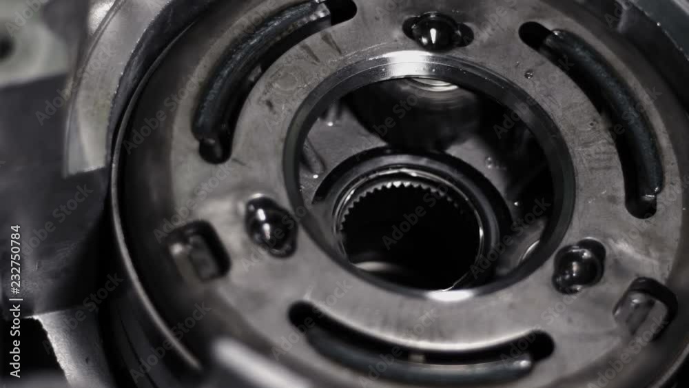 Rotating of metal parts in a mechanical device. Spinning mechanism of car engine Rotating of metal parts in a mechanical device. Spinning mechanism of car engine