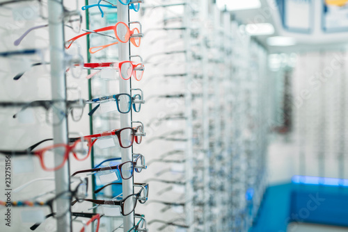 Eyeglasses and sunglasses showcase in optic shop