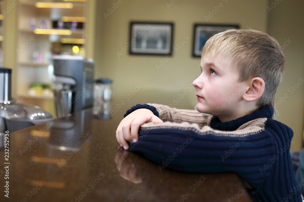 Child sitting at bar Child sitting at bar