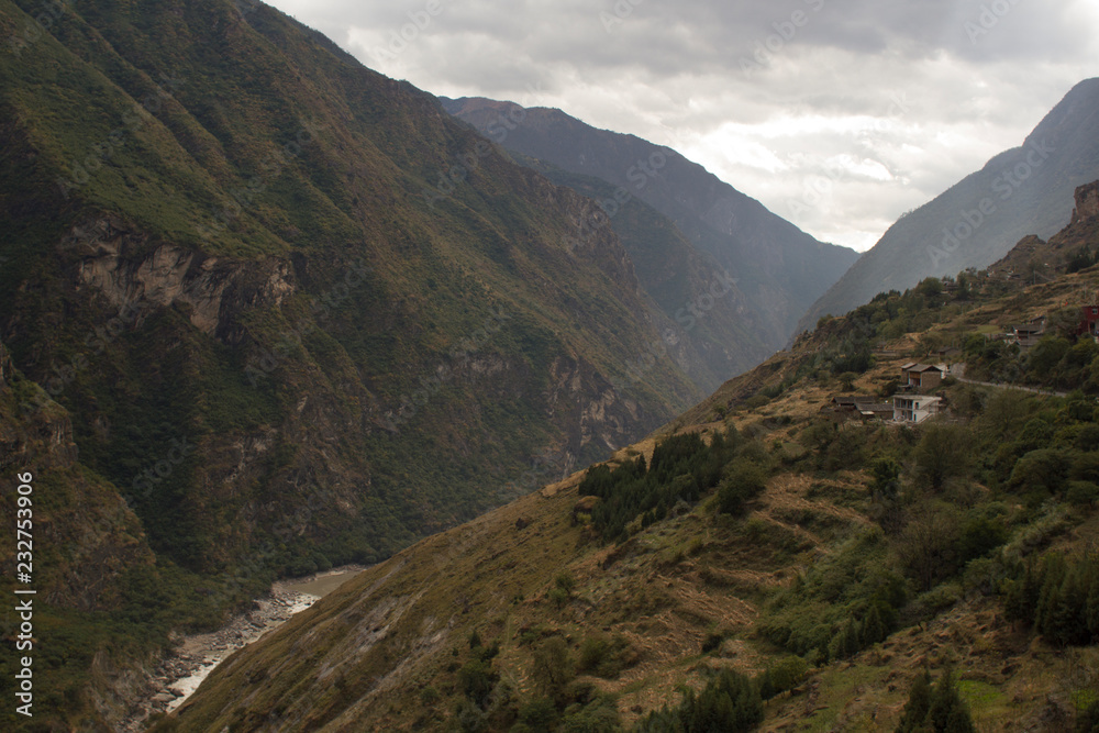Tiger Leaping Gorge, a scenic canyon on the Jinsha River in China. The inhabitants of the gorge are primarily the indigenous Naxi people, who live in a handful of small hamlets.