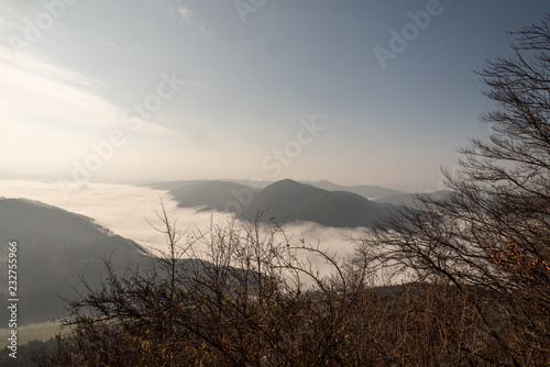 autumn mountain landscape with mist on valleys, mountain ranges and blue sky in Slovakia photo