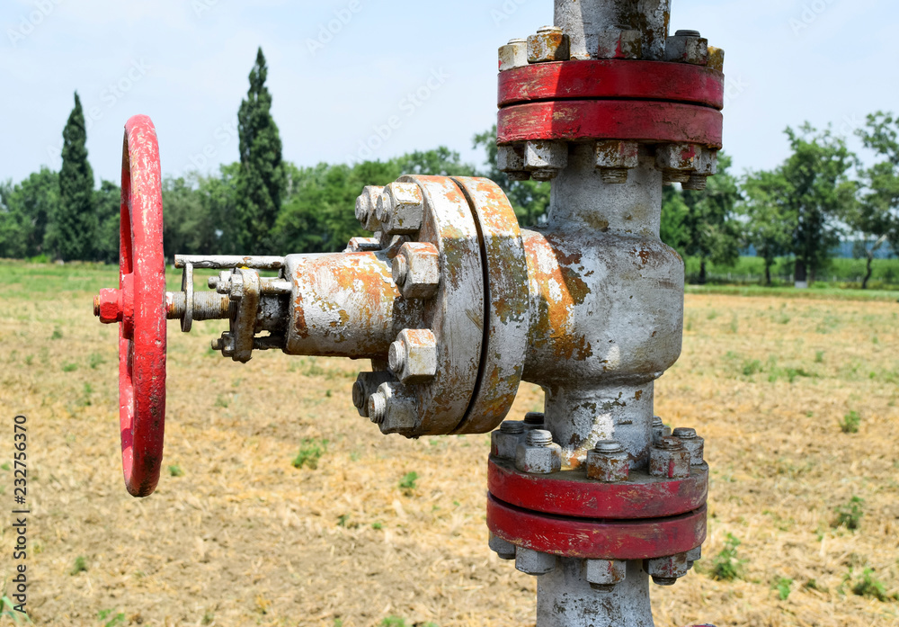 Manual shut-off valve on oil well. Oil well wellhead equipment Manual shut-off valve on oil well. Oil well wellhead equipment