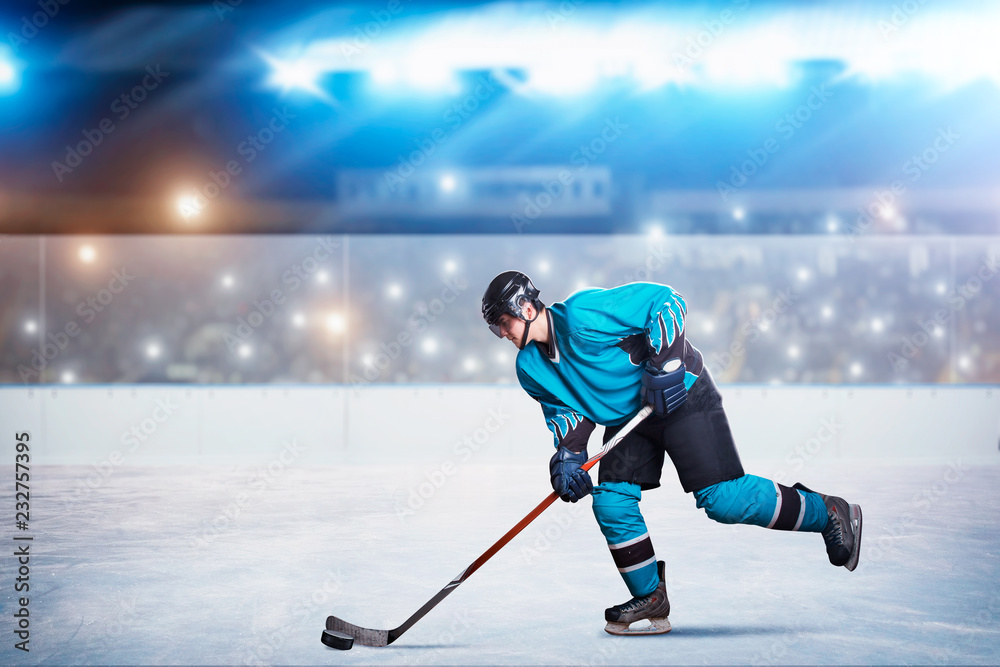Fototapeta premium One hockey player on ice in action, arena
