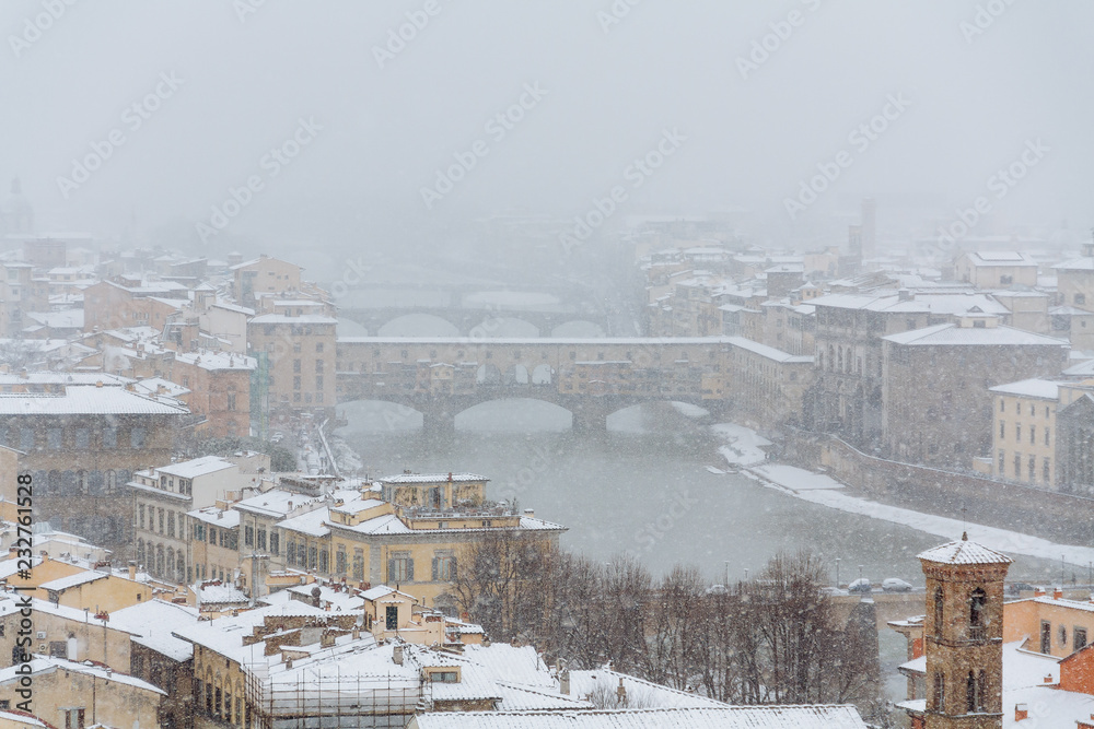 Ponte Vecchio in the winter with snow, Florence, Italy