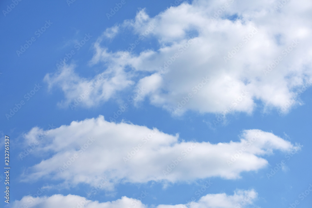 Amazing blue clear sky with white puffy clouds and sunlight Amazing blue clear sky with white puffy clouds and sunlight