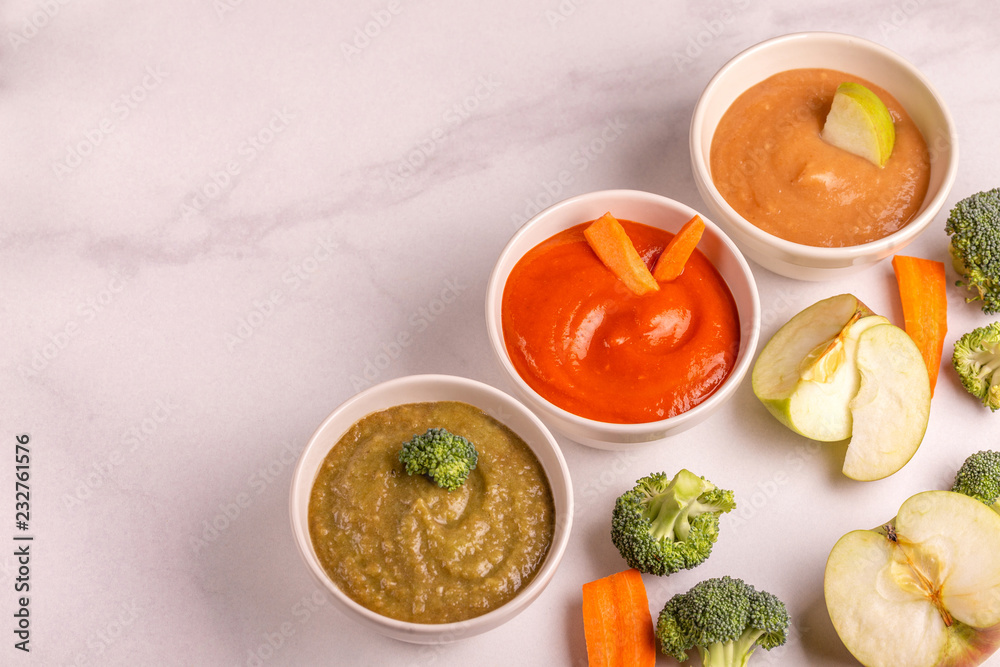 Variation pureed baby food in clay bowls with ingredients Variation pureed baby food in clay bowls with ingredients