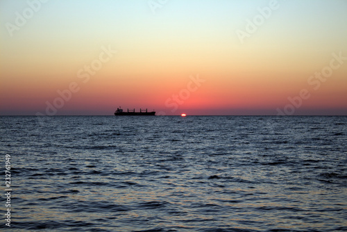 Cargo ship at sunset in the Black sea