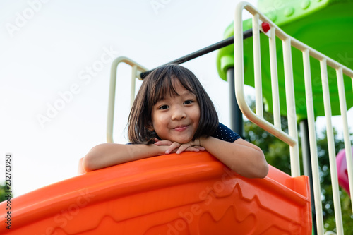 Smiling Little Girl having Fun on Playground.