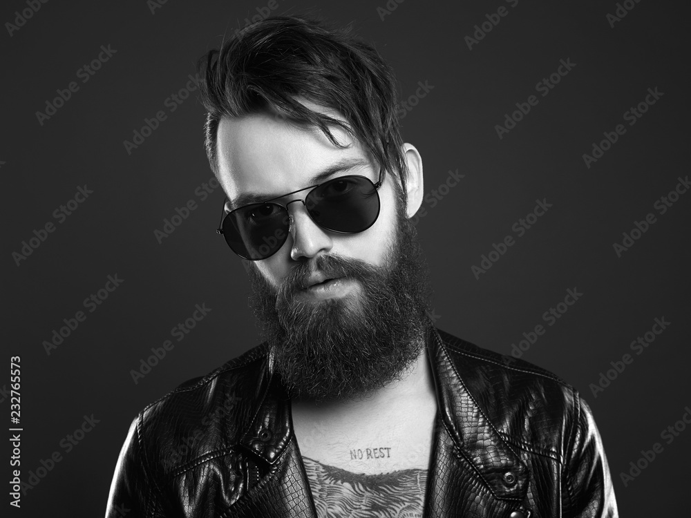 Obraz premium fashionable handsome man in sunglasses