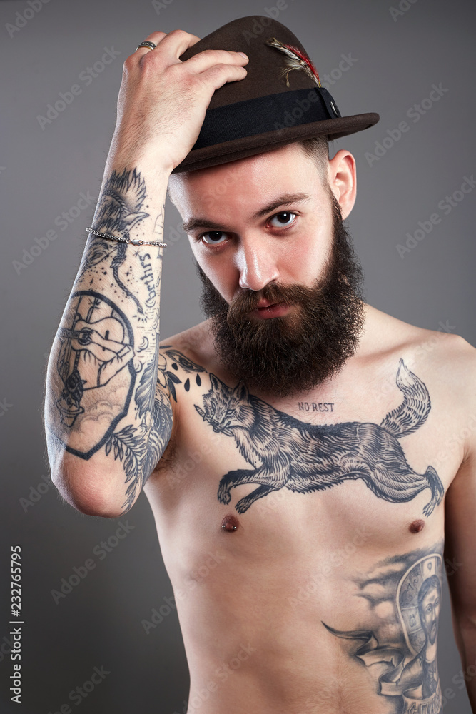 Bearded Man in Hat. boy with tattoo