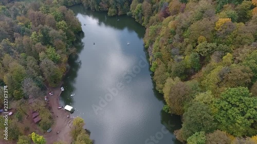 Drone flight over a hidden Parz lake in the Armenian autumn forests photo