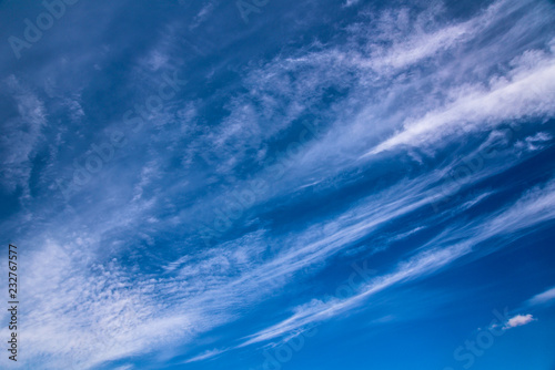 Spindrift clouds on blue sky