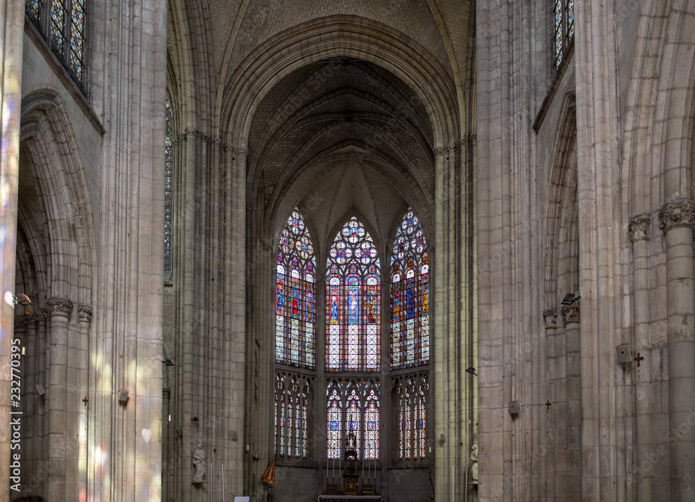 Colorful stained glass windows and altar in  Basilique Saint-Urbain, 13th century gothic church in Troyes, France