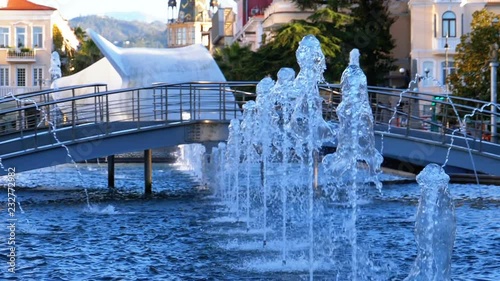 Musical Fountains in the park on the embankment of Batumi, Georgia. Slow Motion in 180 fps. City park. Summer Sunny day. photo