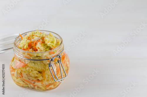 Fermented preserved vegetarian food concept, sauerkraut sour glass jars on the white background, probiotic food concept photo