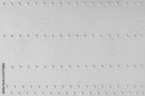 Φωτογραφία Aluminum plate with several rows of rivets as a background