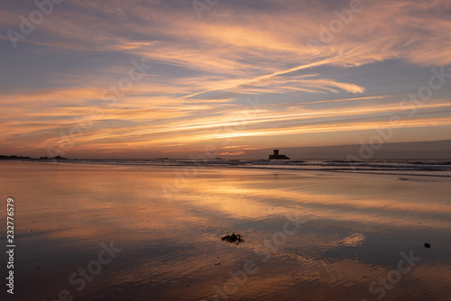 Gorgeous reflections at sunset on St Ouens Bay beach, Jersey, Channel Islands