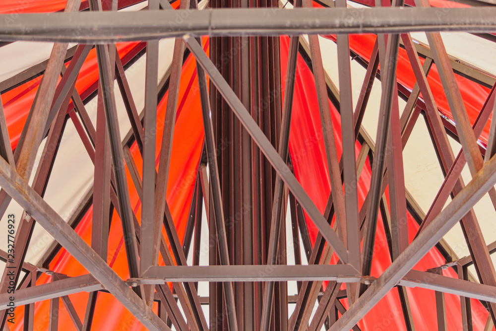 Abstract and geometrical figures in red and white colors with brown and rusty metal structure Abstract and geometrical figures in red and white colors with brown and rusty metal structure