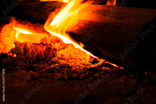 Burning wood. Fire in darkness. 