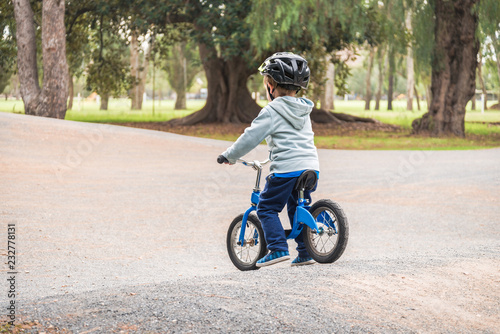 Kid riding balance bike