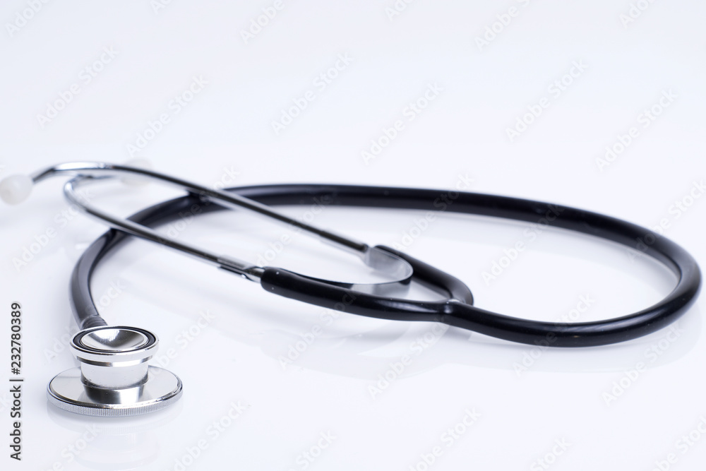 Healthcare or medical concept. Stethoscope and a red heart on a white background. Healthcare or medical concept. Stethoscope and a red heart on a white background.